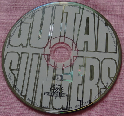 Guitar Slingers CD levy, Voodoo, sisältää 2 raitaa, naarmu
