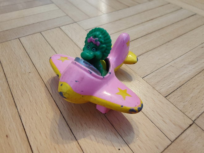 Diecast metallinen dino lentokoneessa