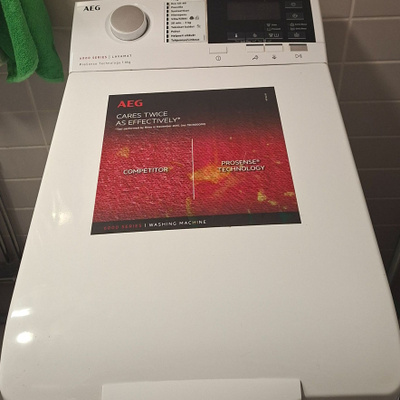 AEG päältä täytettävä vaatteenpesukone