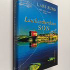 Lars Sund : Lanthandlerskans son : roman - pikkukuva 1