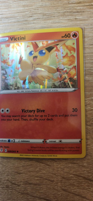 Victini #20 Pokemon Evolving Skies Rare Holo card