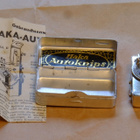 HAKA Autoknips Model II - itselaukaisin, rasia ja käyttöohje - pikkukuva 1