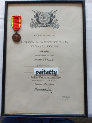 Vapaudenmitali Punaisen Ristin ja myöntökirjan kera 1941