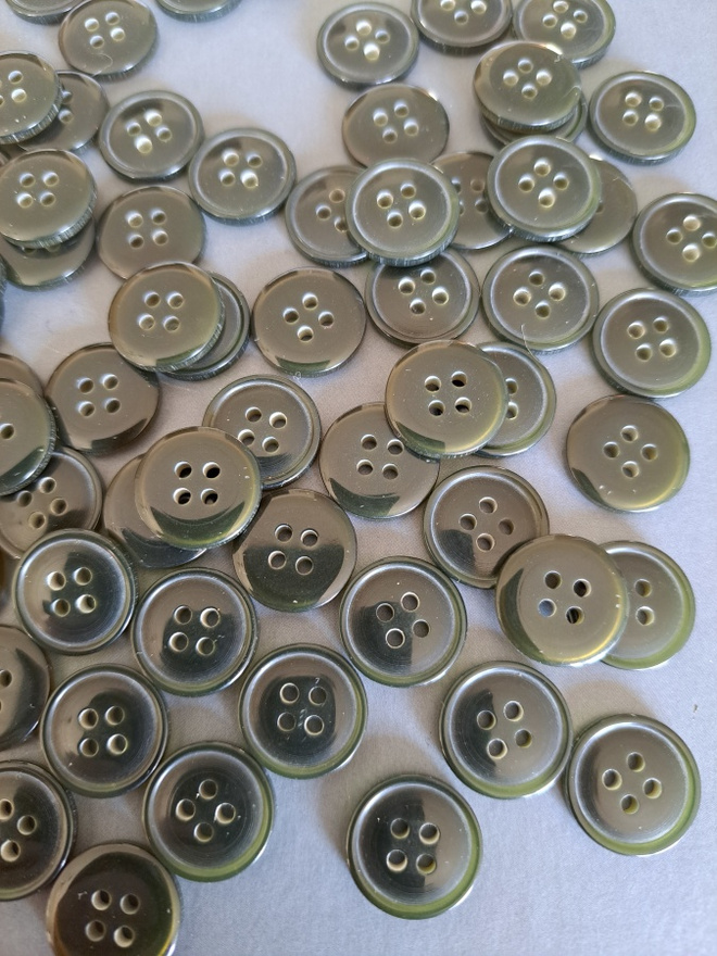 Musta hiukan vihreään taittava nappi 16mm