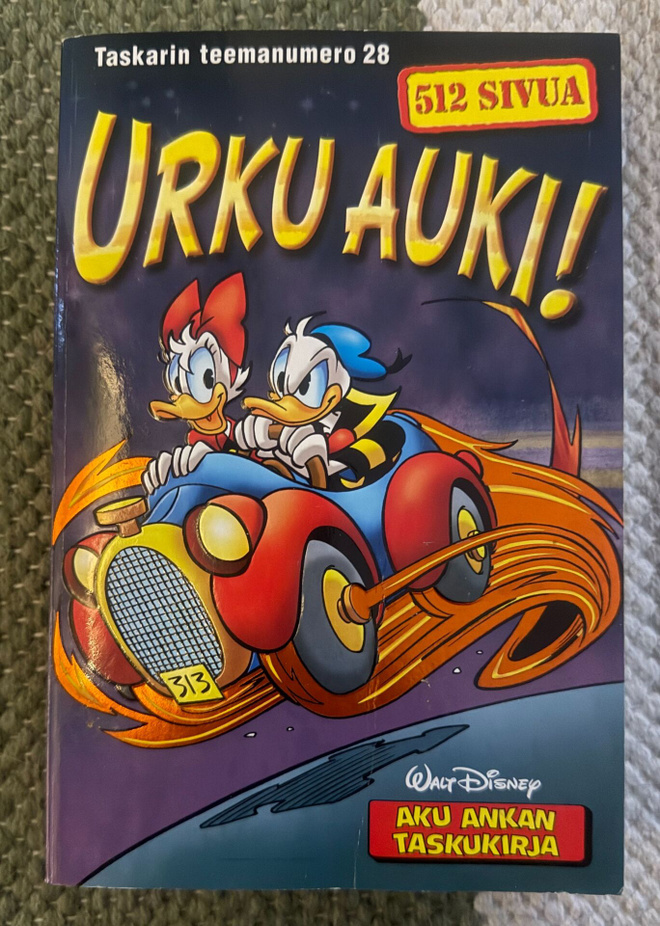 AKU ANKAN TASKUKIRJA TEEMANUMERO 28 - URKU AUKI!
