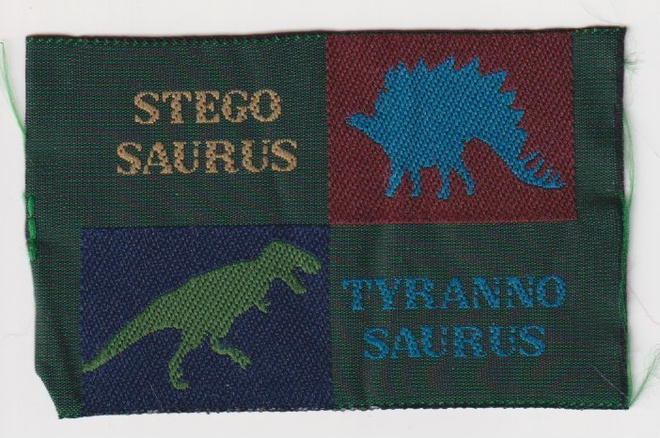 Stegosaurus ja tyrannosaurus - kangasmerkki