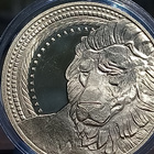 Kullanvärinen kolikko Leijona. Halkaisija - 38 mm. - pikkukuva 5