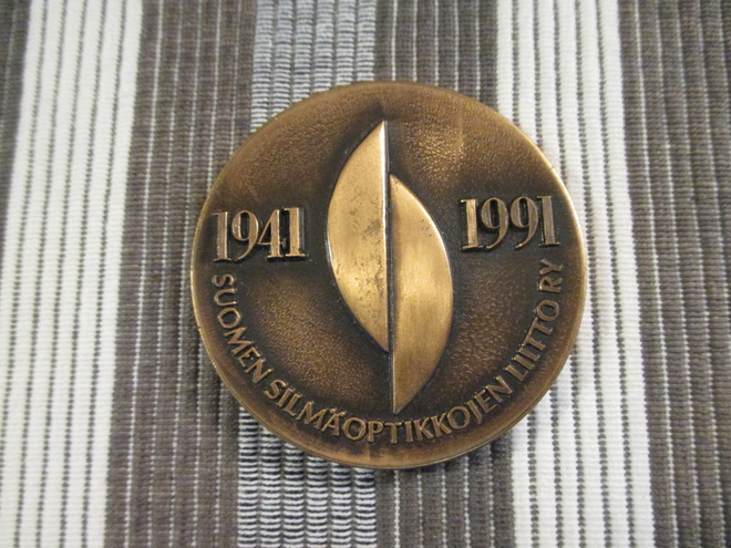 Suomen Silmäoptikkojen Liitto ry.1941-1991 50 V.